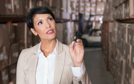 Woman checking inventory in a warehouse